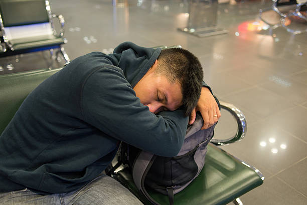 istock The man fall asleep with luggage in hand 498112876