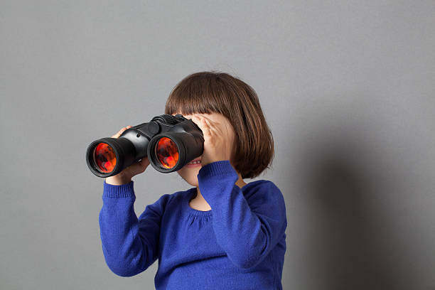 istock imaginative preschooler watching through binoculars for adventure concept 498113482