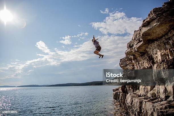 Cliff Jumping Stock Photo - Download Image Now - Cliff Jumping, Cliff Diving, Stunt Person