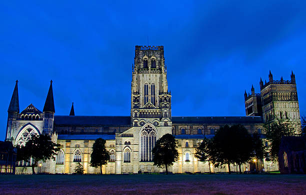 Durham Cathedral At Night County Durham, Durham Cathedral at Night, looking over Palace Green against deep blue sky river wear stock pictures, royalty-free photos & images