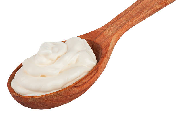 istock Handful of mayonnaise in wooden spoon isolate 498114306