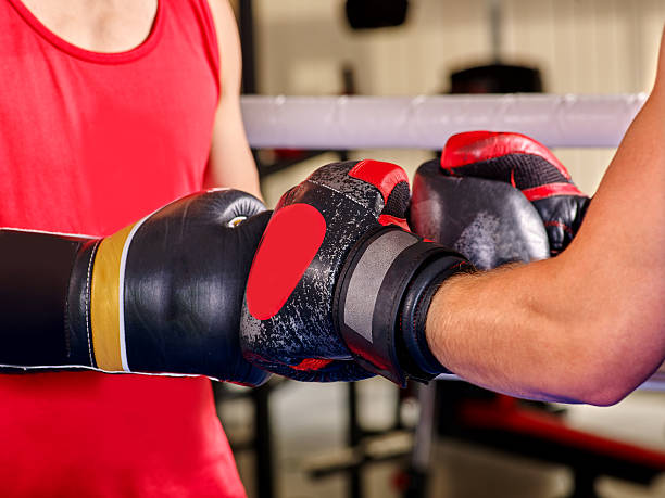 istock Men hands  boxer wearing helmet  boxing 498114420