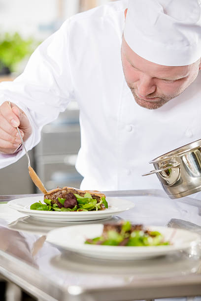 istock Professional chef prepare meat dish at restaurant 498114870