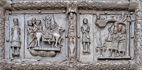 Ancient bronze gates of Magdeburg in Veliky Novgorod, Russia. Fragment of the bas-relief with Jesus Christ and scenes from Bible.