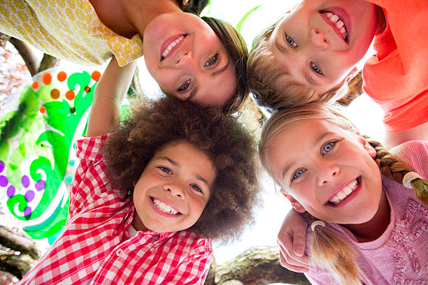 istock Happy with Heads Together Looking Down Smiling 498115711