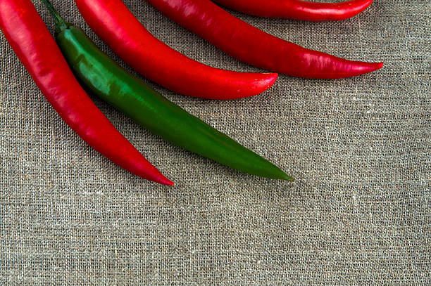 istock Top view of peppers: chili and paprika pepper on linen 498116516