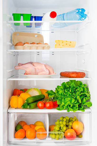 istock shelf of the refrigerator with food 498116616