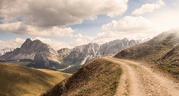 istock single female hiker admiring stunning mountains view 498116968