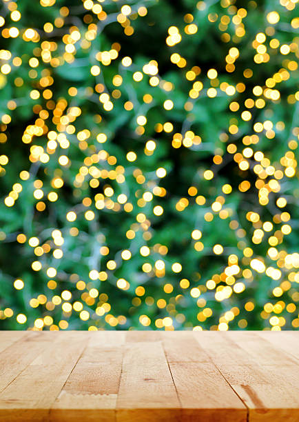 istock Wood table top on bokeh background from christmas tree 498117696