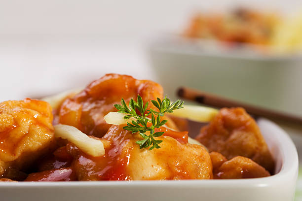 istock Fried chicken pieces in batter with sweet and sour sauce 498118468