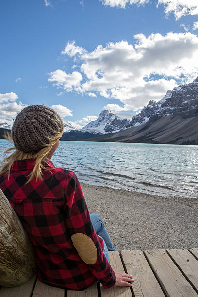 istock Girl relaxing by the lake 498119032