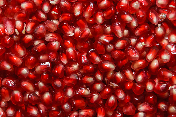 istock pomegranate seeds as food background 498120262