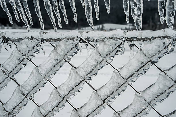 istock icicle and frozen fence 498121634