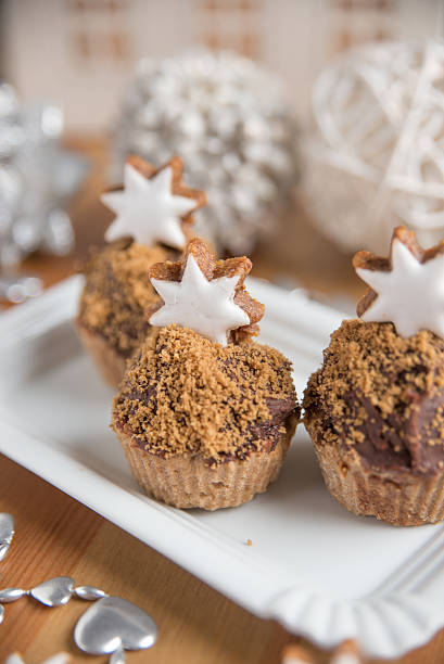 istock Gingerbread Cupcakes with cinnamon star cookies 498121896