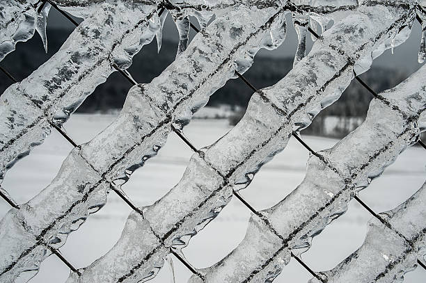 istock icicle on frozen fence 498122294