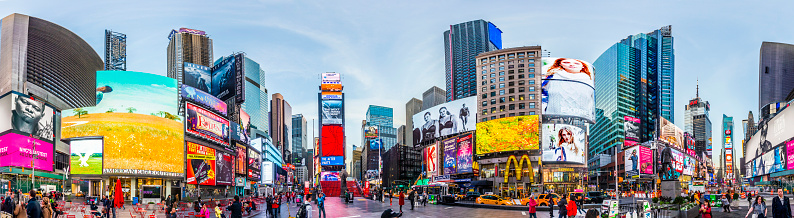 New York, USA - October 21, 2015: people visit Times Square, featured with Broadway Theaters and huge number of LED signs, is a symbol of New York City and the United States.