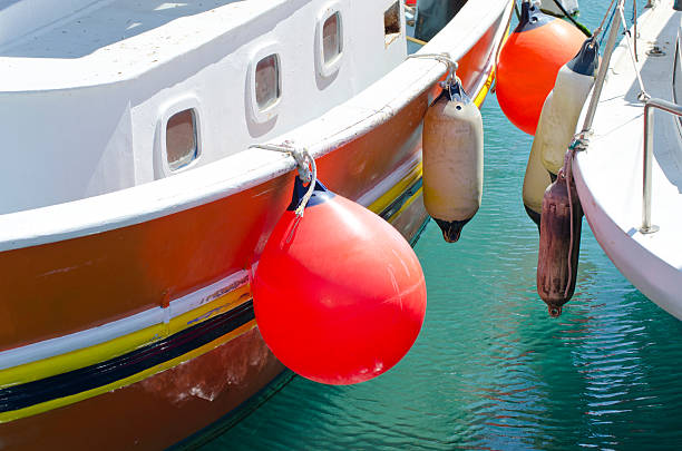 istock two boats with orange and white buoys 498125190