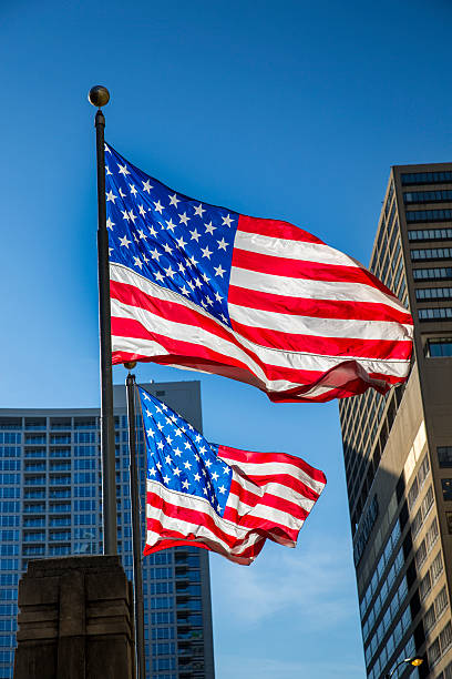 istock USA flag blows in the wind downtown Chicago 498127219