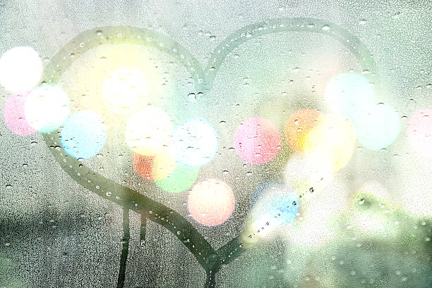 istock Autumn rain, draw heart on glass - love concept 498127302