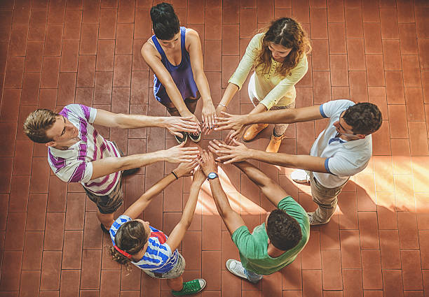 istock Group of volunteer with arm outreached 498127643