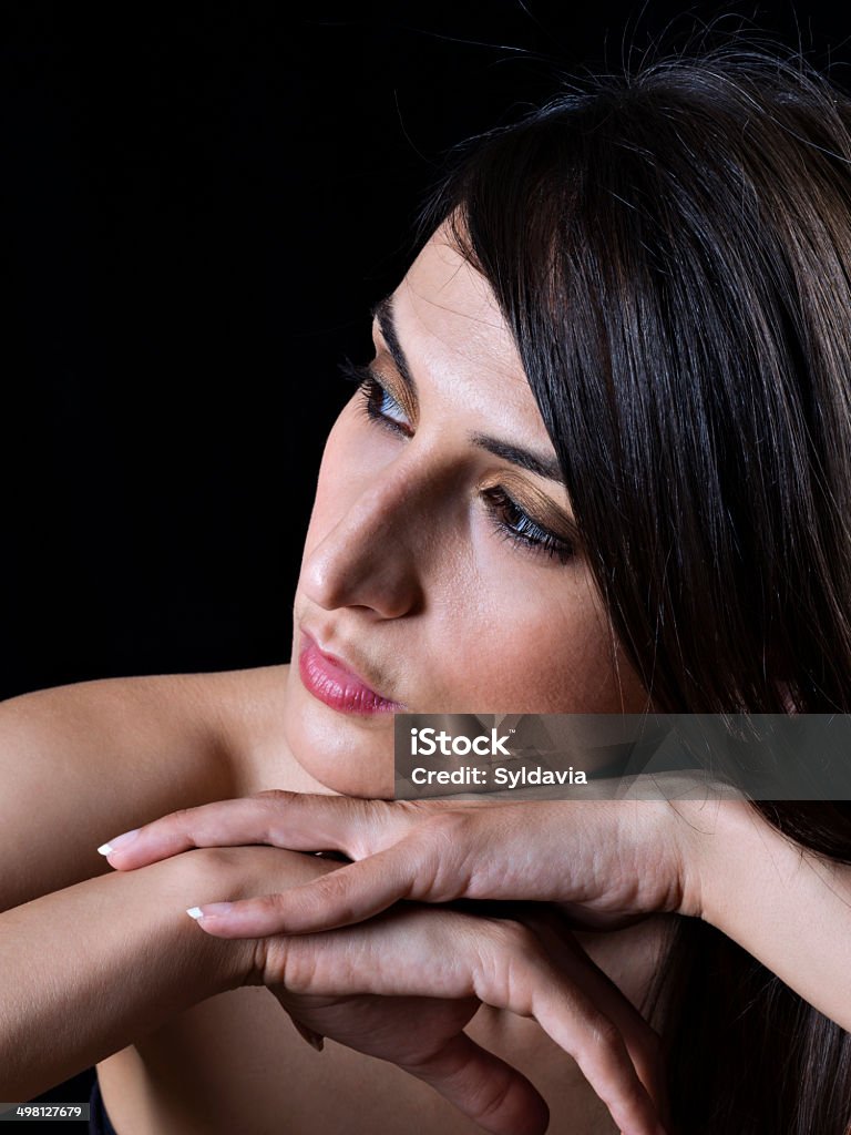Portrait Portrait of a young woman with hands on chin 35-39 Years Stock Photo