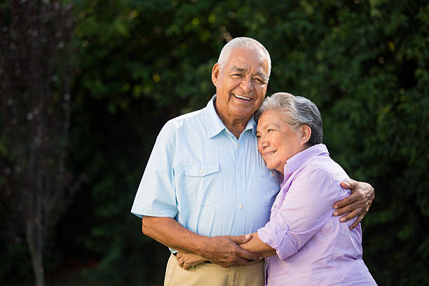 istock Latin couple hugging in the park 498127855