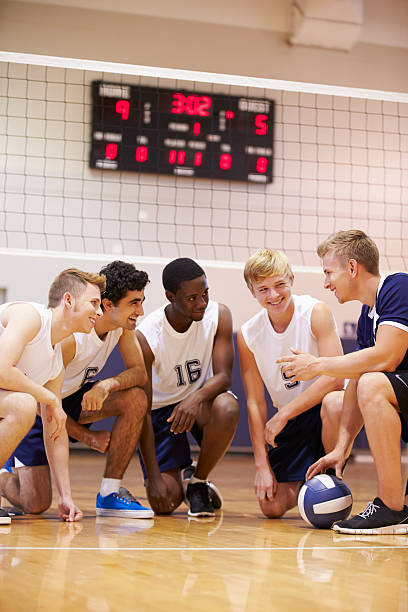 istock Male High School Volleyball Team Having Team Talk From Coach 498128331