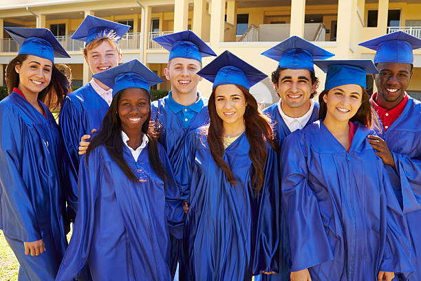 Group Of High School Students Celebrating Graduation Smiling To Camera