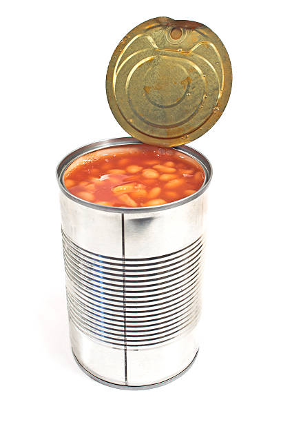 istock Open tin can of beans isolated on white 498129165