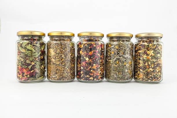 istock transparent glass jars of different herbs 498130151