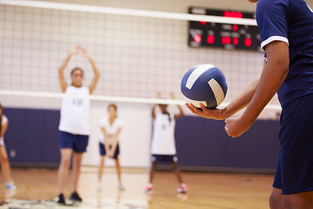 high school-volleyball-match im fitnessraum - serving people teenage girls female stock-fotos und bilder