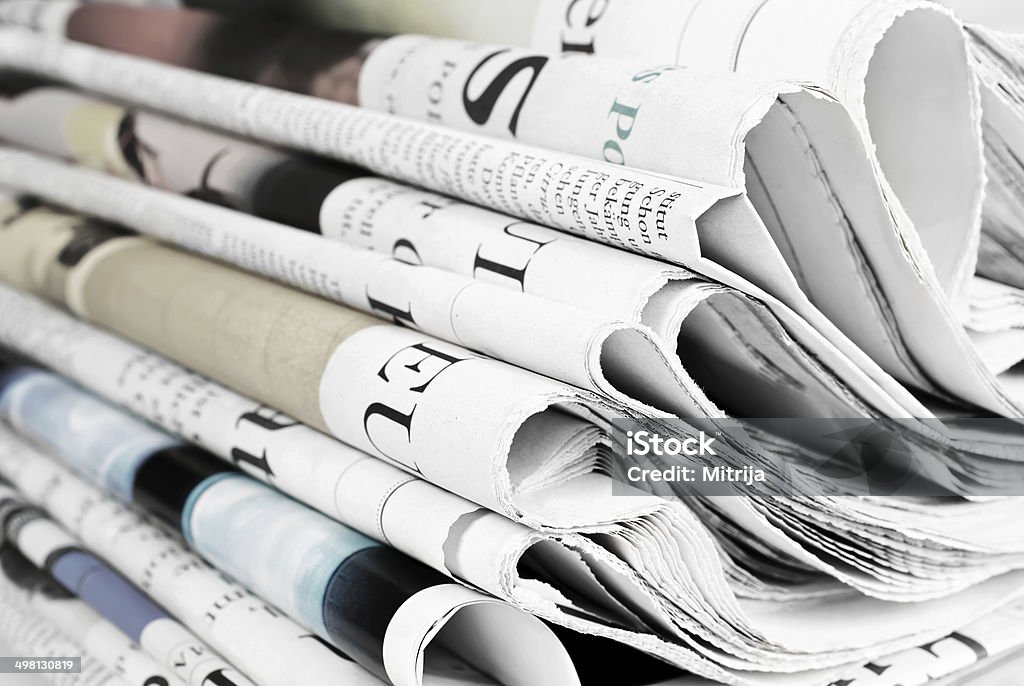 Pile of old newspapers Pile of folded old newspapers Newspaper Stock Photo