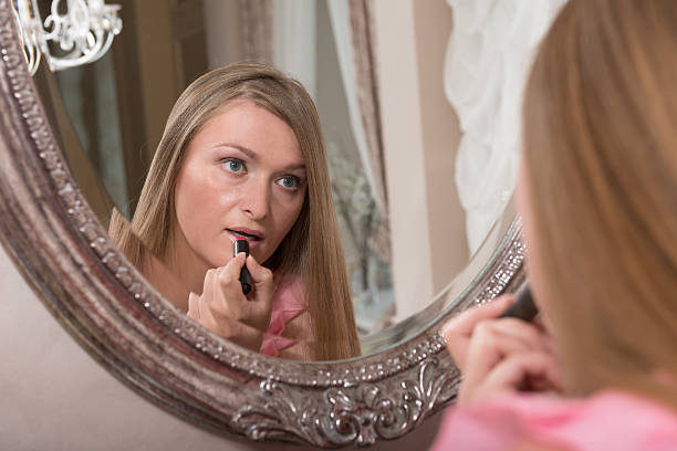 istock Young woman in front of a mirror 498130879