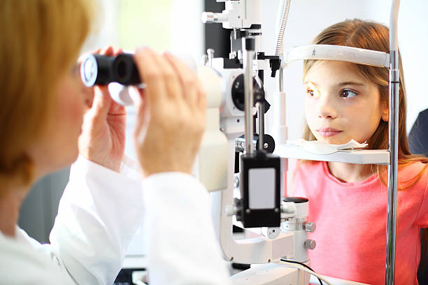istock Little girl at optician. 498131837