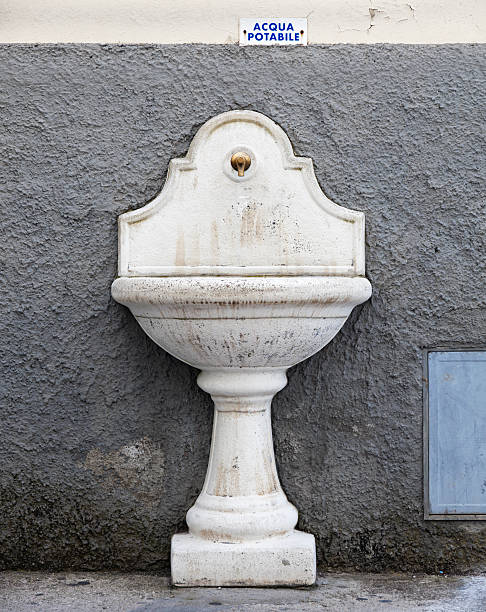 istock Ancient drinking fountain in white marble from Italy 498132435