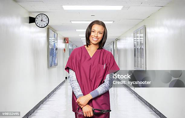 Confident Female Medical Professional Stock Photo - Download Image Now - Female Nurse, Medical Scrubs, 20-29 Years