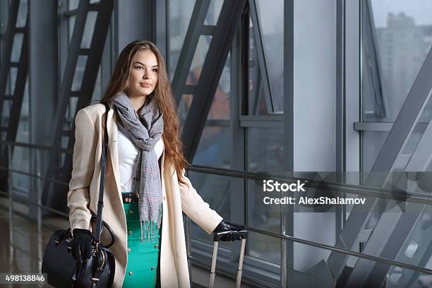 Girl Is On The Move With A Suitcase Stock Photo - Download Image Now - 2015, Adult, Airport