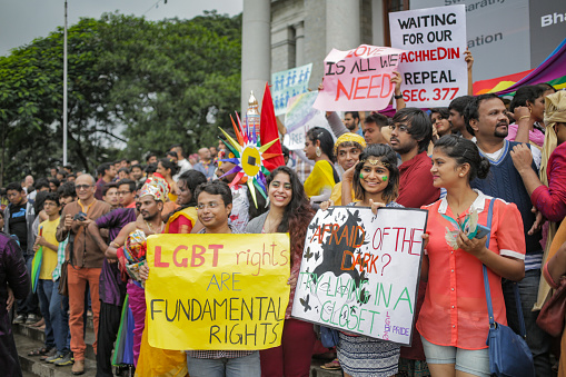 Bangalore, India - November 22, 2015: A picture from the Pride Parade 2015 in Bangalore, India. A crowd is gathered outside the town hall with signs.