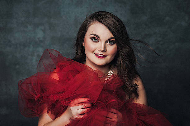 istock Beautiful elegant young woman in red 498139888