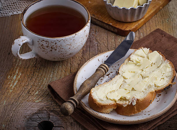 istock Homemade bread with butter on wooden background 498142854