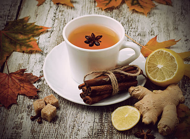 istock Ginger, lemon and cop of tea on light background 498145650
