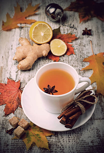 istock Ginger, lemon and cop of tea on light background 498148586