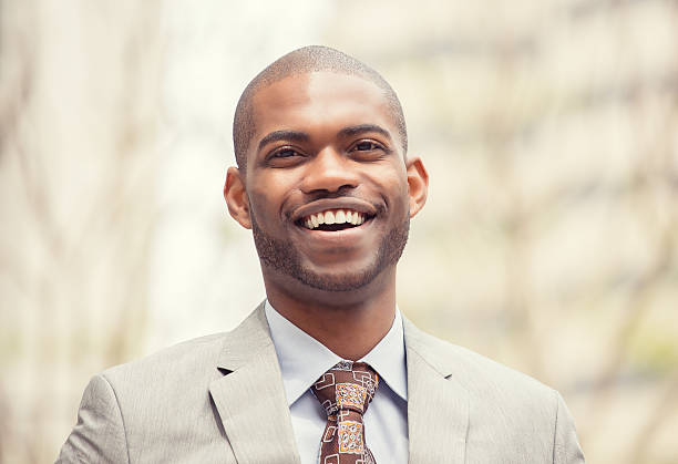 istock Headshot young professional man smiling laughing 498148980