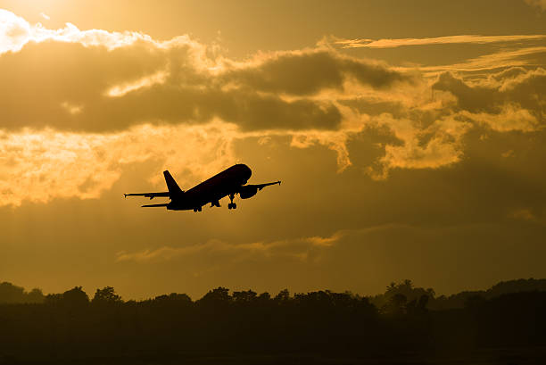 istock Silhouette plane take off in morning 498149098