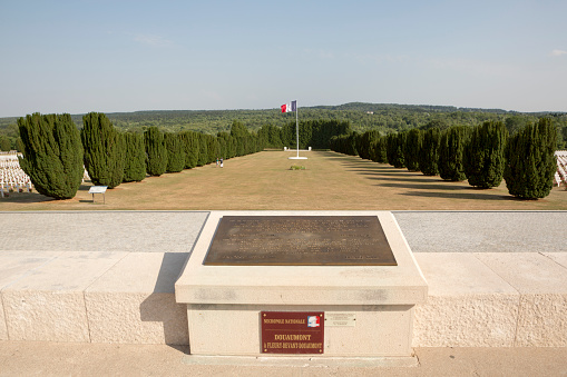 Douaumont, France - July 17, 2015:  Hundreds of thousands of soldiers were killed during the Battle ofVerdun, remembered here at the Douaumont Ossuary.  Tombstones, grave markers and roses are found throughout the site.  Its a famous place where the French pay their respects, in particular on Armistice Day. 