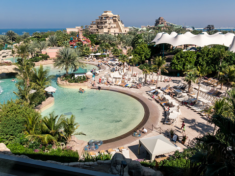 Dubai, United Arab Emirates - January 25, 2014: View from above of people enjoying vacation in Atlantis Water Park on The Palm island