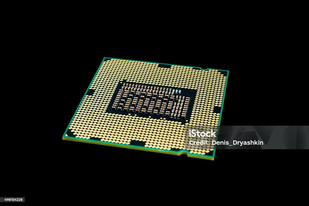 Electronic collection - Computer CPU (Central Processing Unit) Electronic collection - Computer processor from the bottom side isolated on black background 2015 Stock Photo