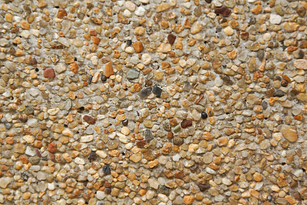 istock Closeup of Stones and Sand Wall Background 498168495