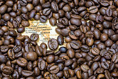 Map of Central America under a background of coffee beans