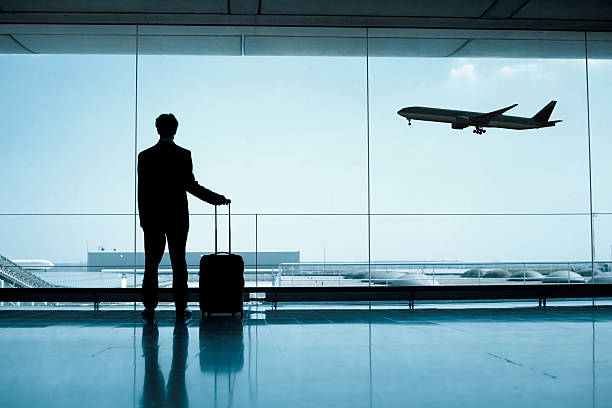 business travel businessman at the airport airport terminal stock pictures, royalty-free photos & images